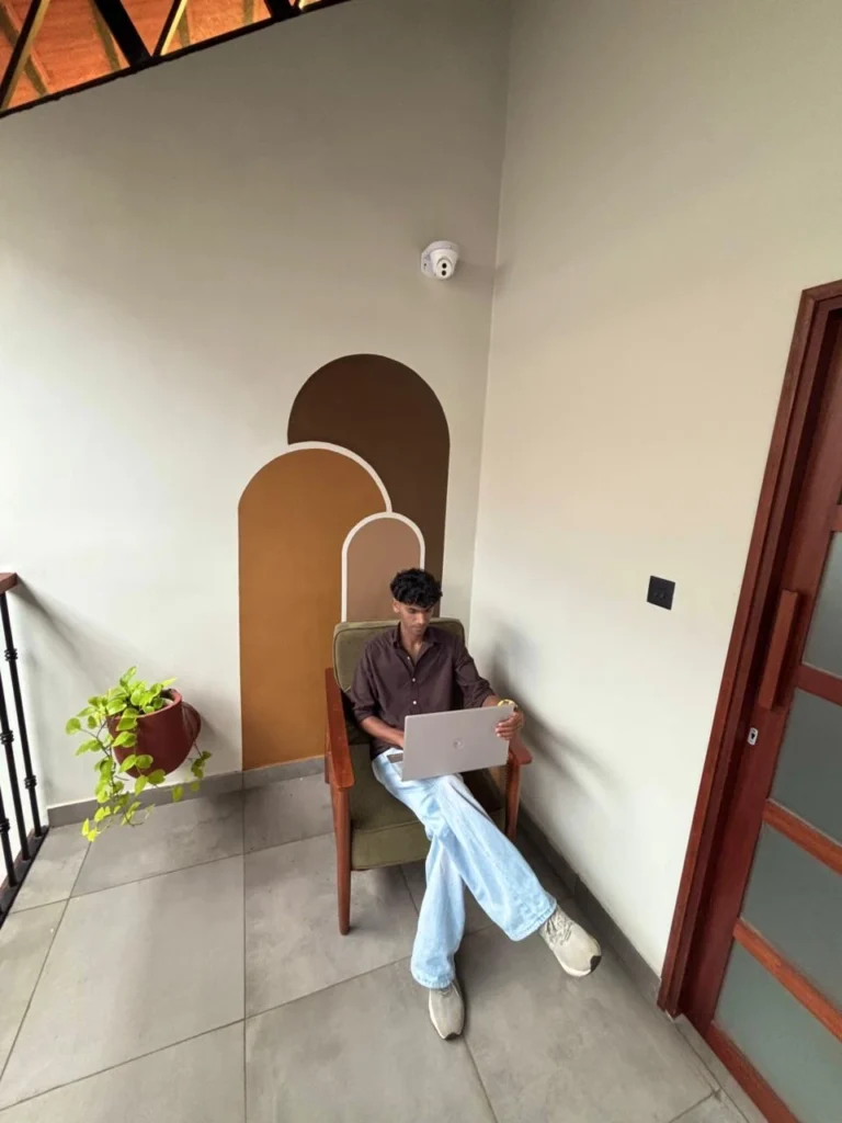 mohammed afeef work at laptop a digital marketing expert in malappuram